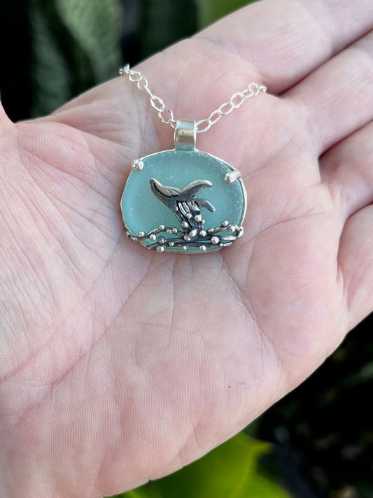 Breeching humpback necklace